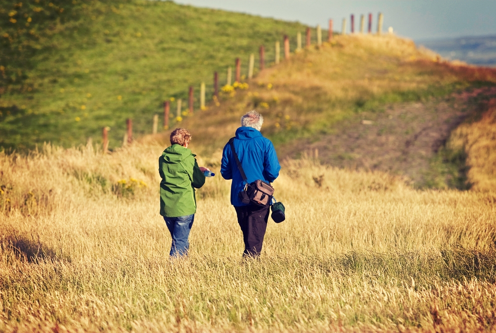 couple walking in a field