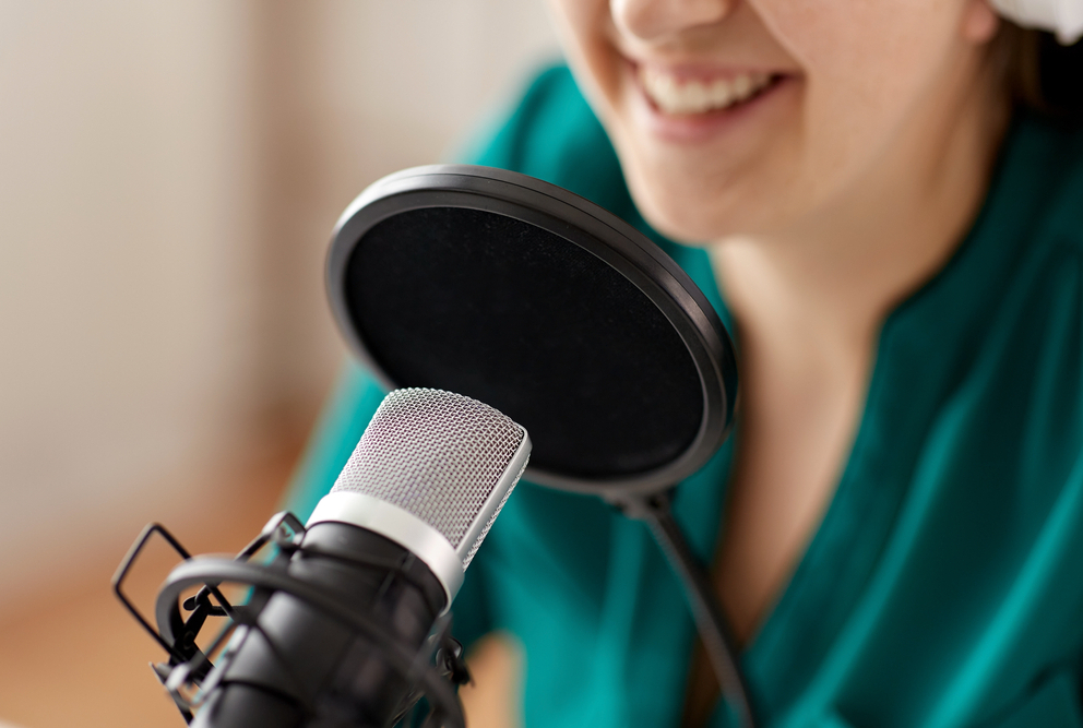 woman speaking into microphone