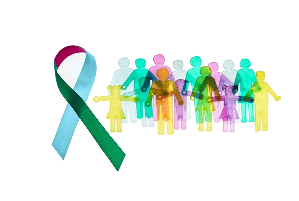 Colorful awareness ribbon with group of people with rare diseases, using the colors associated with Rare Disease Da