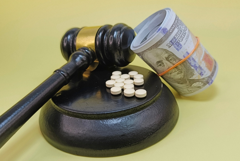 gavel with pills and money