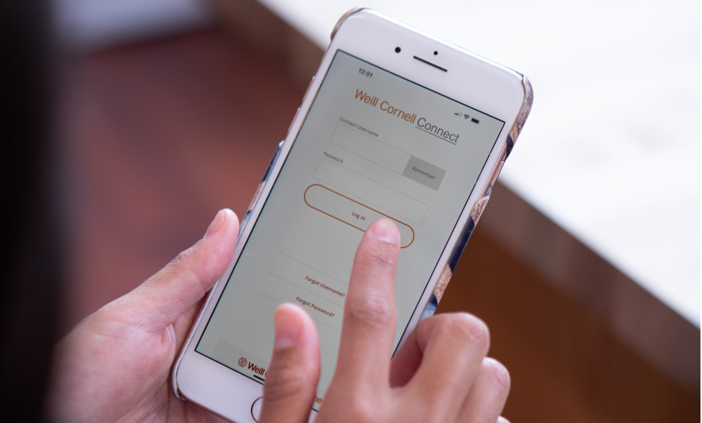 hands holding smartphone making selection in app