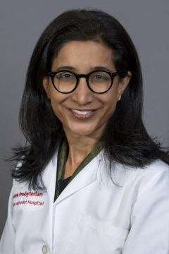 a woman smiling for a portrait