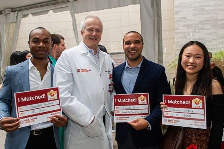 Group of people pose for a photo during an event