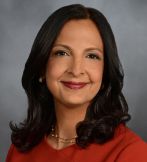 a woman posing for a headshot photo