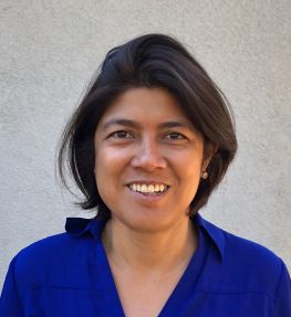 a woman smiling for a portrait