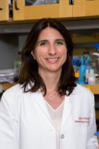 a woman in a lab posing for a picture