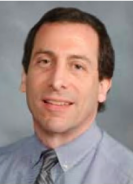 a man posing for a headshot photo