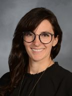 a woman smiling for a portrait