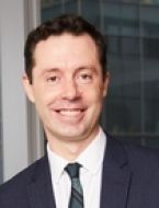 Dr. Olivier Elemento a man in a suit posing for a picture