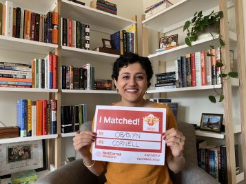 Woman holding up a sign