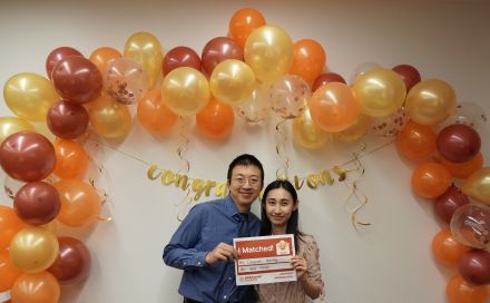 A couple poses together during Match Day 2021