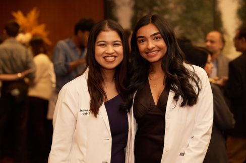 Students pose for a photo at a reception