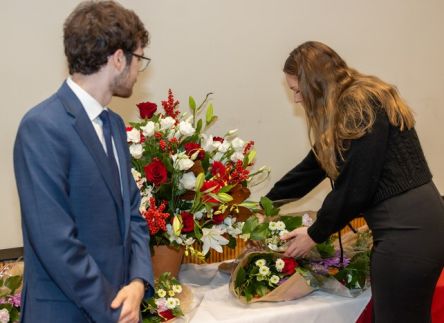 Students lay flowers