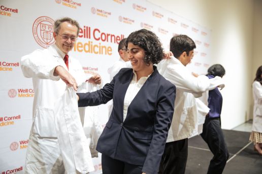 A student getting coated by a faculty member