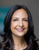 a woman smiling for a portrait